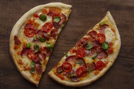 pizza with meat and basil sprout.の写真素材
