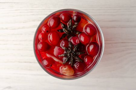 Orange and cranberry punch with orange slices and spices.の写真素材