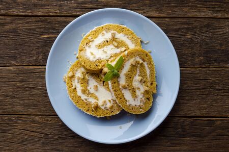 Pumpkin Roll with powdered sugar with walnuts and pumpkin seeds.の写真素材