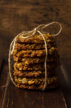 Pumpkin vegan oatmeal cookies with nuts on woodenの写真素材
