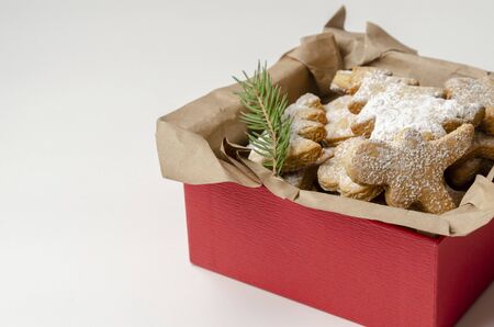 gingerbread christmas cookies in the box on white wooden boardsの写真素材