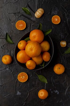 Tangerine orange and Tangerine orange slices on a Darkの写真素材