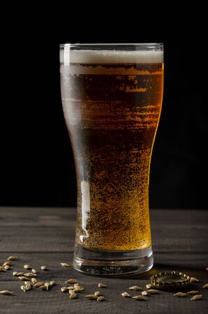 beer bottle on black background with glassの写真素材