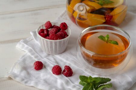 Fruit hot tea with the addition of oranges, lemons, raspberriesの写真素材