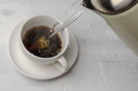 Cup with chicory drink on cement background. Healthy drink