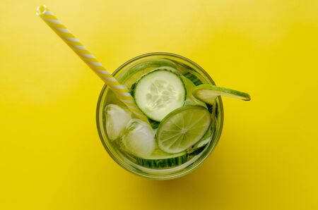 Infused water on a glass. Detox water mix of cucumberの写真素材