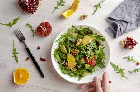 Avocado with Orange arugula salad with olive oil andの写真素材