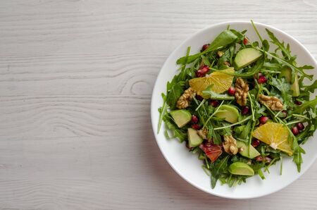 Avocado with Orange arugula salad with olive oil andの写真素材