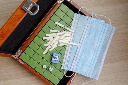 Mahjong table game on of Chinese city street or japaneese riichi mahjong. Quarantine and home games.