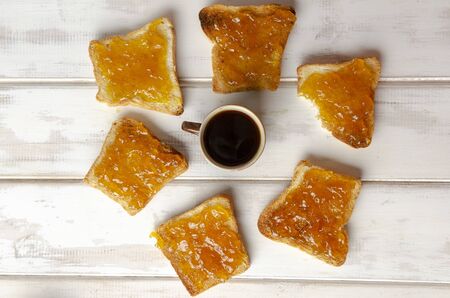 sandwich with fruit jam with espresso cup