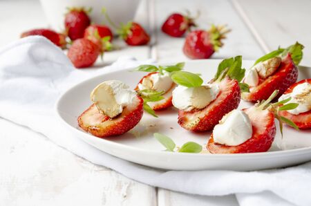 plate with fresh strawberry with cream cheese, balsamic vinegarの写真素材
