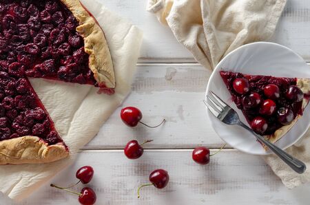 Tasty cherry pie on white woodenの写真素材