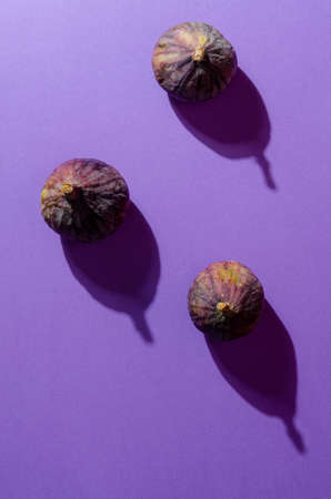 still life organic fig fruits, violet background. copy spaceの写真素材