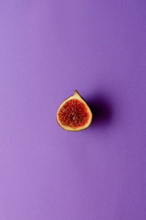 still life organic fig fruits, violet background. copy space