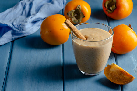 Persimmon smoothie with orange, milk andの写真素材
