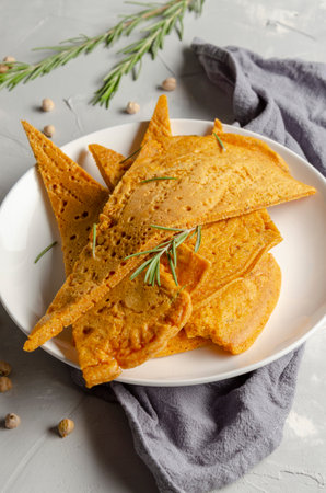 Homemade socca or farinata on gray backの写真素材
