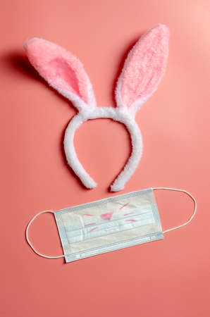 Easter bunny with medical mask on ink background. Easterの写真素材