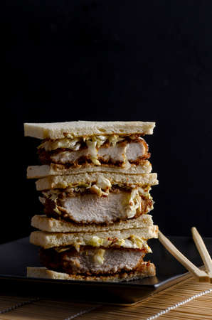Katsu sandos japanese sandwich with chicken or pork chop, cabbage and tonkatsu sauce.の写真素材
