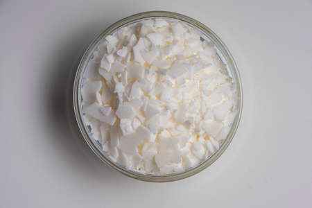 Set for crafting candle. Eco soy wax on white table. DIY candle. Hobby concept.