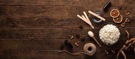 Set for crafting candle on wooden background. Eco soy wax on white table. DIY candle. Hobby conceptの写真素材
