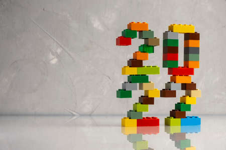 2022 numbers from kids constructor on gray background with reflectionの写真素材