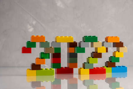 2022 numbers from kids constructor on gray background with reflectionの写真素材