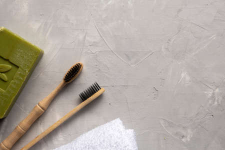 Eco friendly bamboo tooth brush on gray background. Space for textの写真素材