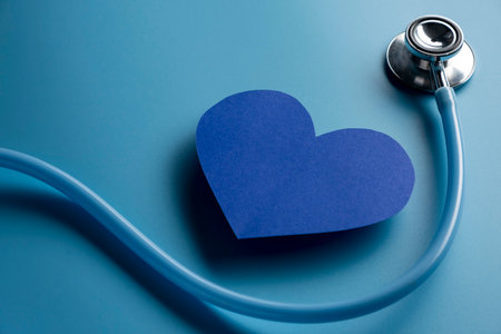 World health day. Blue heart and stethoscope on light blue background. Space for textの写真素材