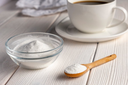 Herbal sweetener stevia in spoon and a cup of coffeeの写真素材
