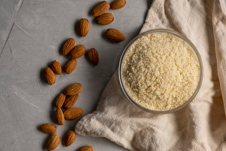 Almond flour and almonds in bowls. Gluten free food concept.の写真素材
