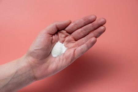 Enzyme powder for washing the skin on pink backgroundの写真素材