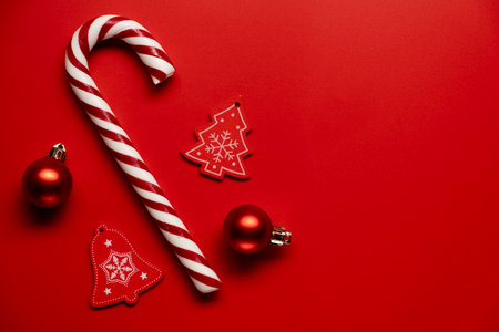 Christmas candy canes against a red backgroundの写真素材
