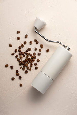 Manual coffee grinder on beige background.の写真素材