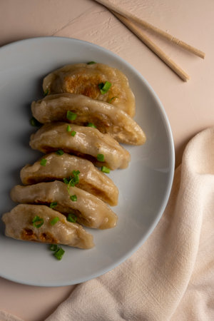 Plate with gyoza, dumplings with soy sauce.