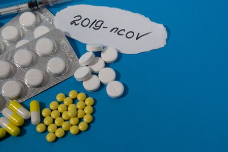 New coronavirus-2019-November. Protective drugs, tablets, syringes, ampoules against the virus. The Chinese outbreak of coronavirus. Middle East respiratory syndrome coronavirus MERS-Cov.の写真素材