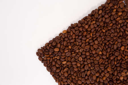 Coffee beans isolated on white background with copyspace for text. Coffee background or texture...