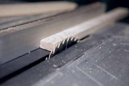 Table and a circular blade circular sawing machine. Close-up photoの写真素材