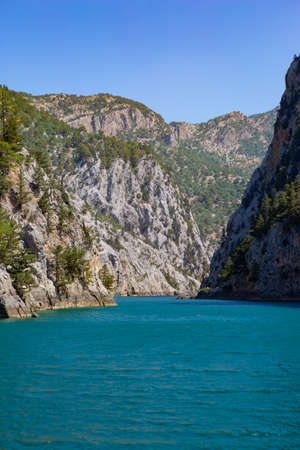 Horizontal panorama of Turkey Green Canyon. natural beauty of turkey. Summer landscape with mountains and forest, turquoise lake. Beautiful mountain lake between rocks.の写真素材