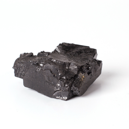 Black coal closeup on a white background. Solid fossil fuel.の写真素材