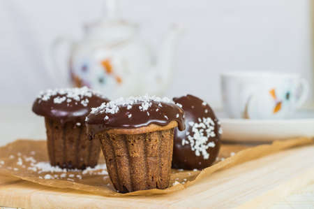 Three chocolate cupcake with icing and coconut strushkoyの写真素材
