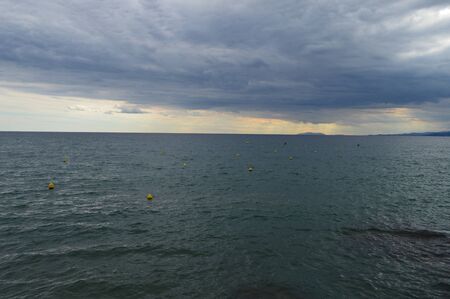 Incredibly beautiful sky before a thunderstorm off the coastの写真素材