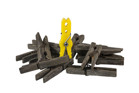 Old and new clothespins on a white background