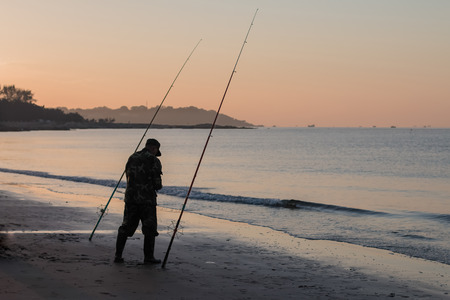 Morning fishing on the bank of the Yellow Sea in Chinaの写真素材