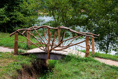 The bridge through a ravine from a tree with a handrailの写真素材