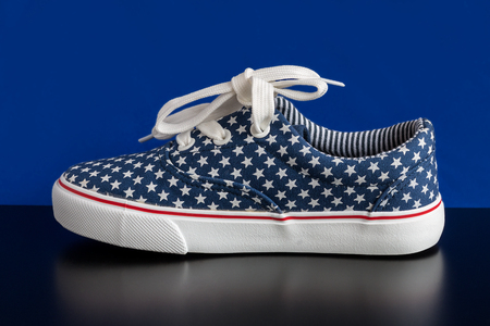 Summer children's sneakers with a white laceの写真素材