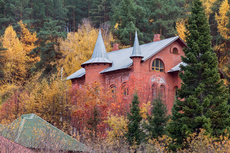 The stone house in the autumn wood in Belokurikhaのeditorial素材