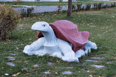 Sculpture of a turtle at a playground in city parkの写真素材