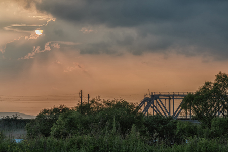 The sun at sunset in cloudy weatherの写真素材