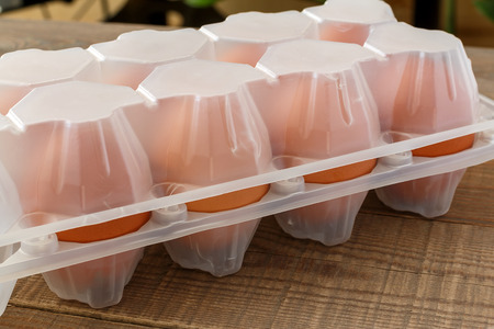 Egg in a plastic container on a table