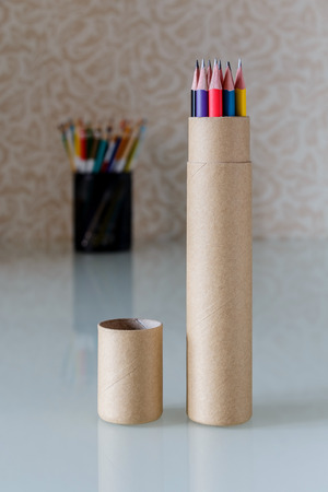 Simple pencils in cardboard packaging on a tableの写真素材